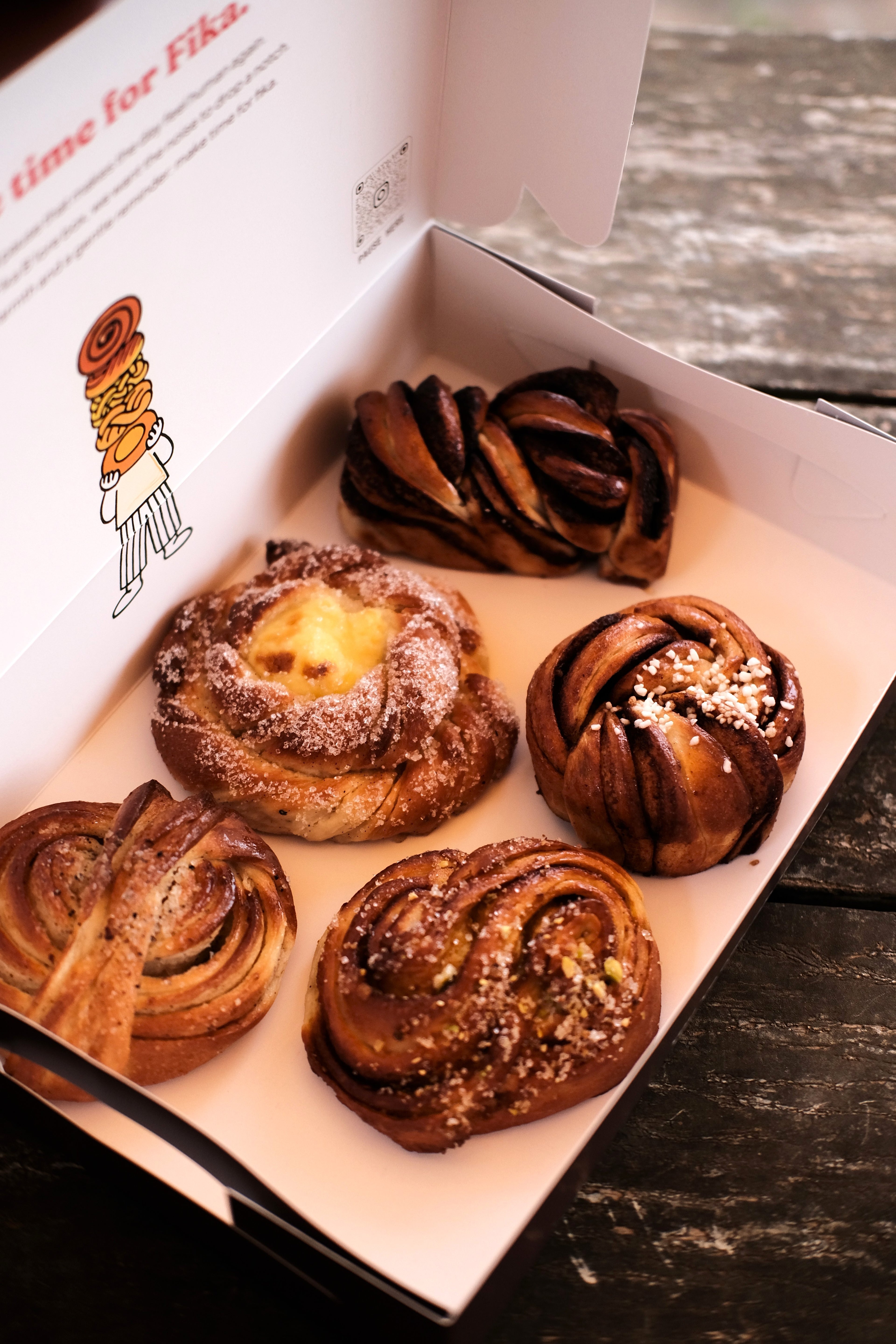 FIKA FIVE, an assorted box of 5 Swedish buns including cinnamon, cardamom, sun, chocolate, and almond varieties